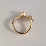 Common :: Handcrafted two stone ring showcasing round and marquise cut lab diamonds.