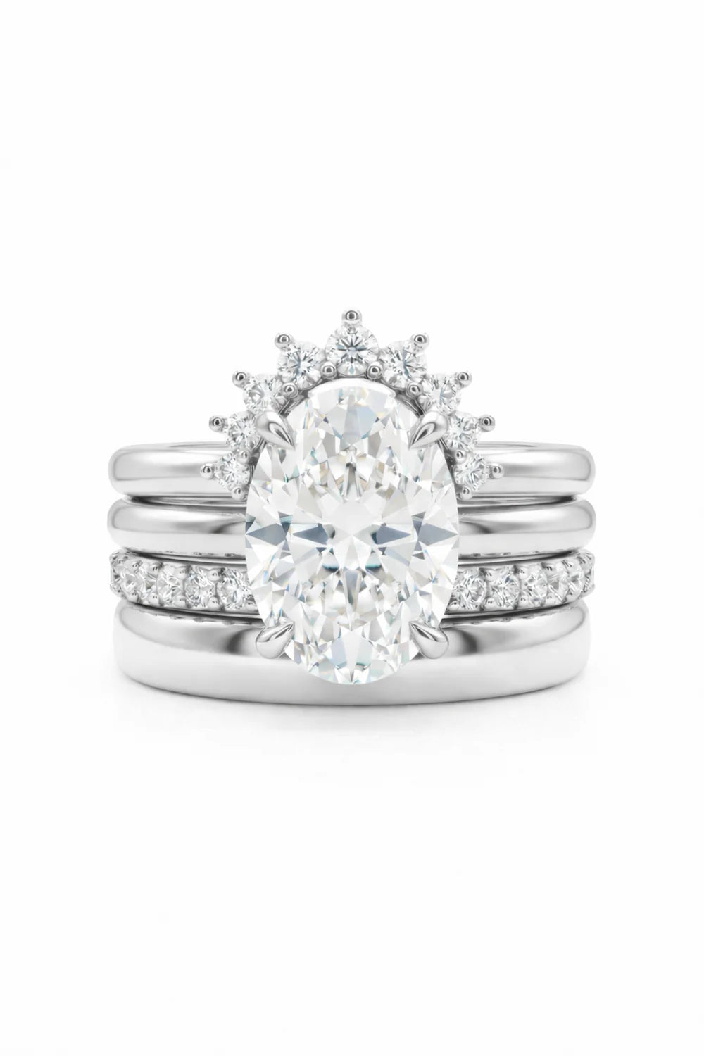 Common :: Elegant quad-layer bridal ring crafted in 18K gold with an oval center diamond.