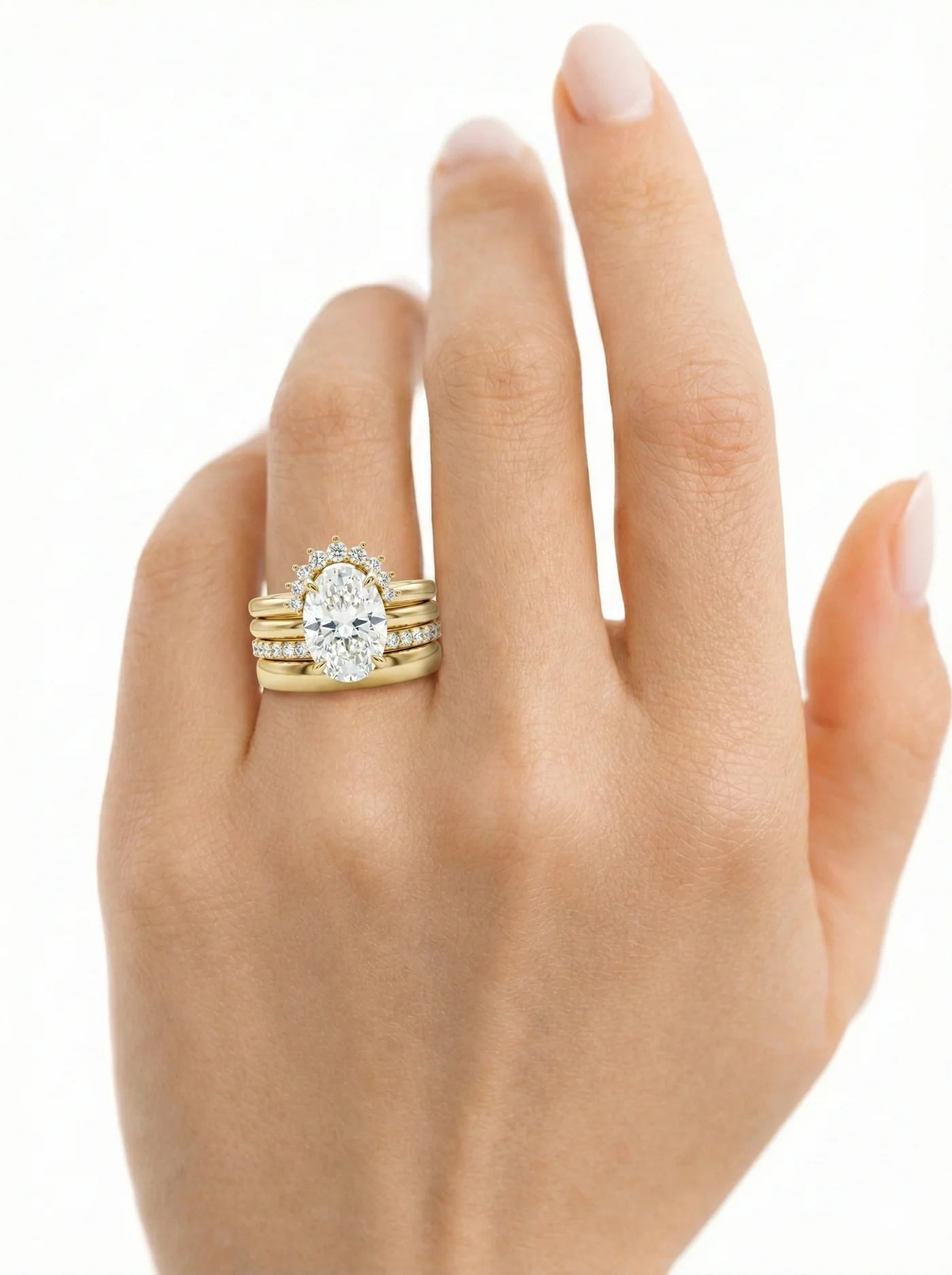 Common :: Luxury oval bridal stack featuring four distinctive diamond bands and IGI certified diamonds.