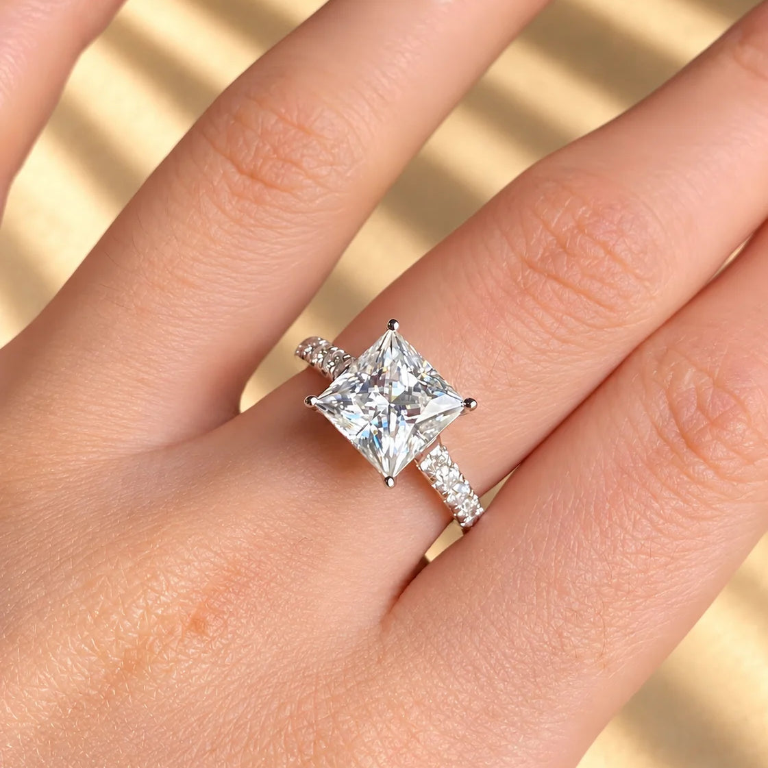 Common :: 3.00CT princess-cut lab grown diamond engagement ring with IGI-certified center stone.