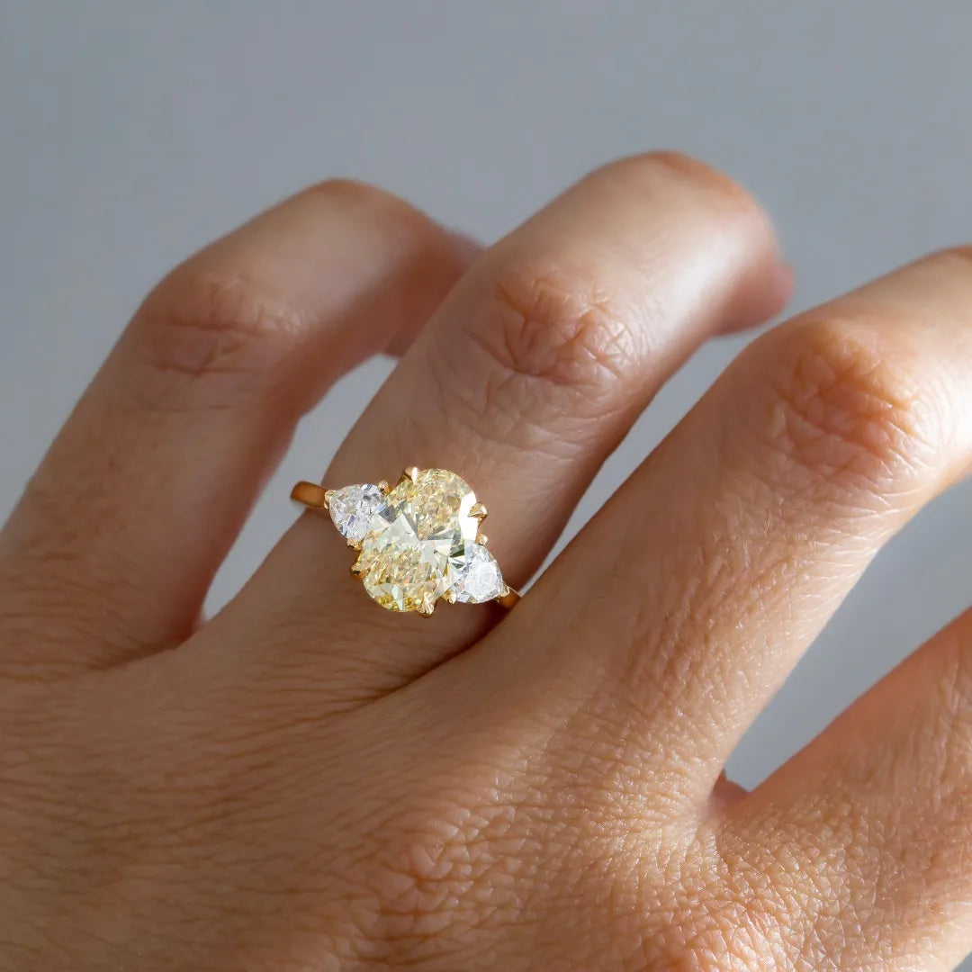 Common :: yellow oval lab grown diamond three stone engagement ring luxury yellow diamond ring