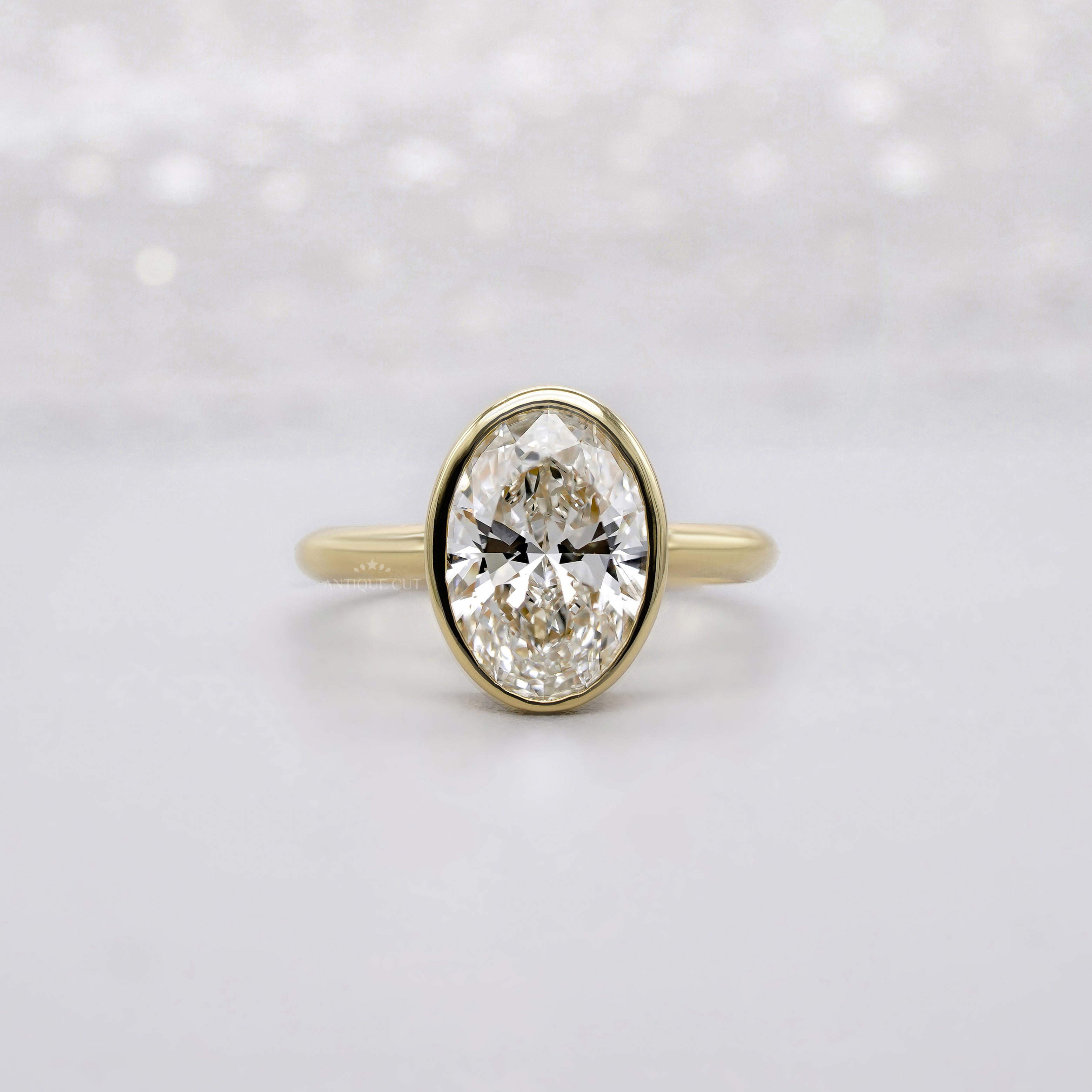 Oval 2.00ct Lab Grown Diamond Bezel Set Engagement Ring in Yellow Gold | IGI Certified