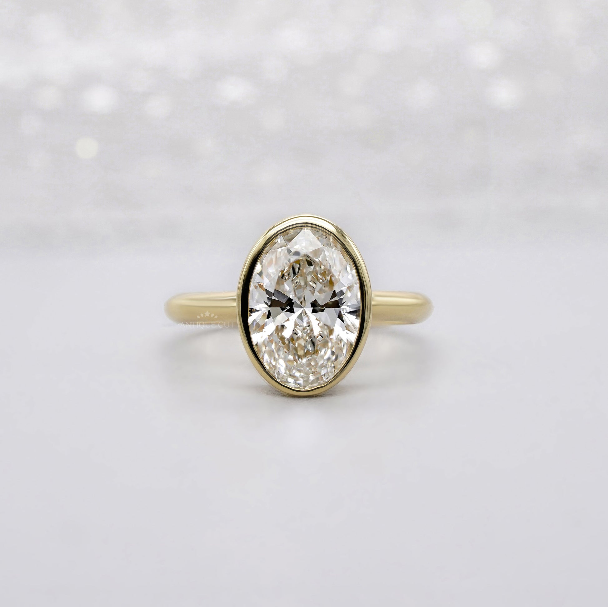 Oval 2.00ct Lab Grown Diamond Bezel Set Engagement Ring in Yellow Gold | IGI Certified