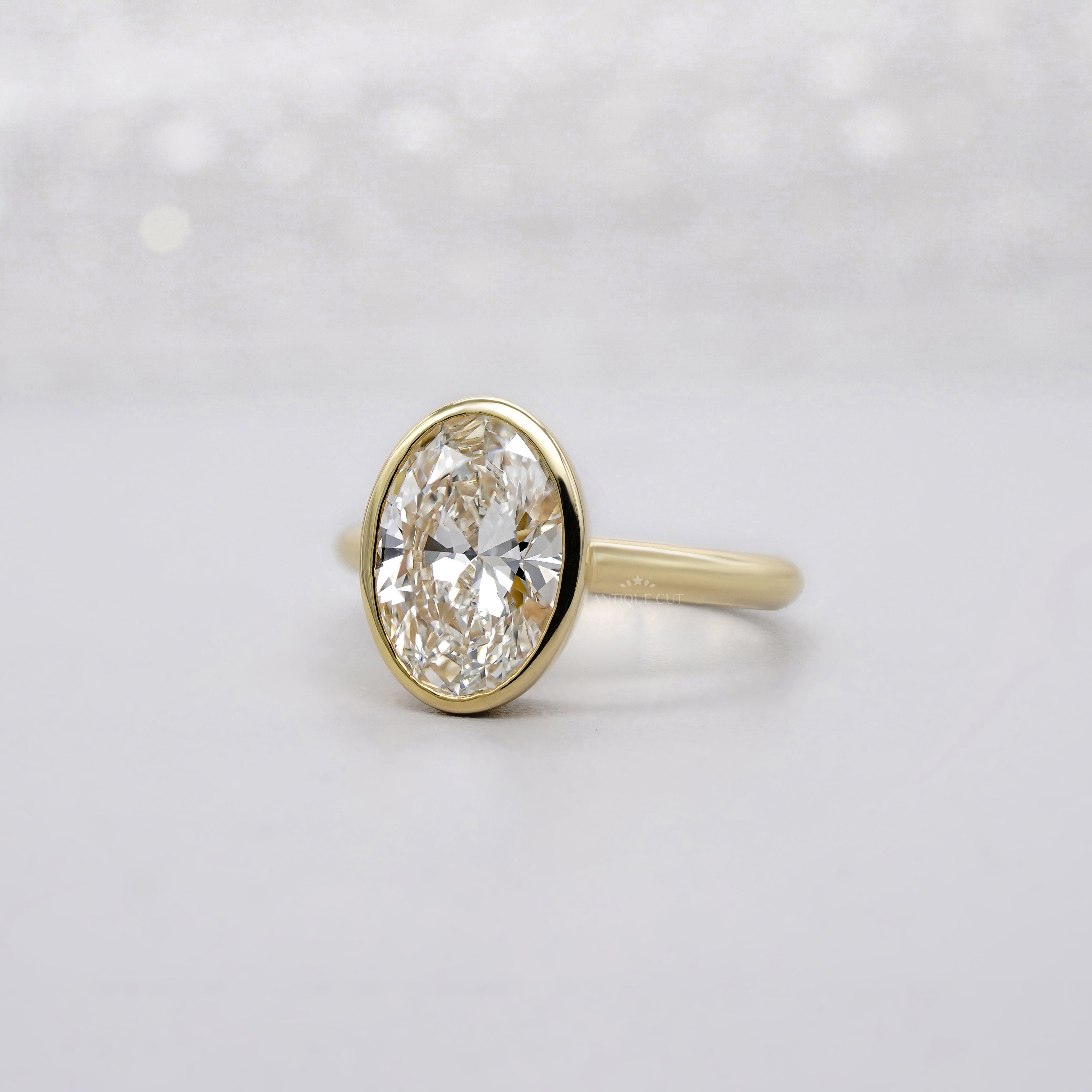 Oval 2.00ct Lab Grown Diamond Bezel Set Engagement Ring in Yellow Gold | IGI Certified