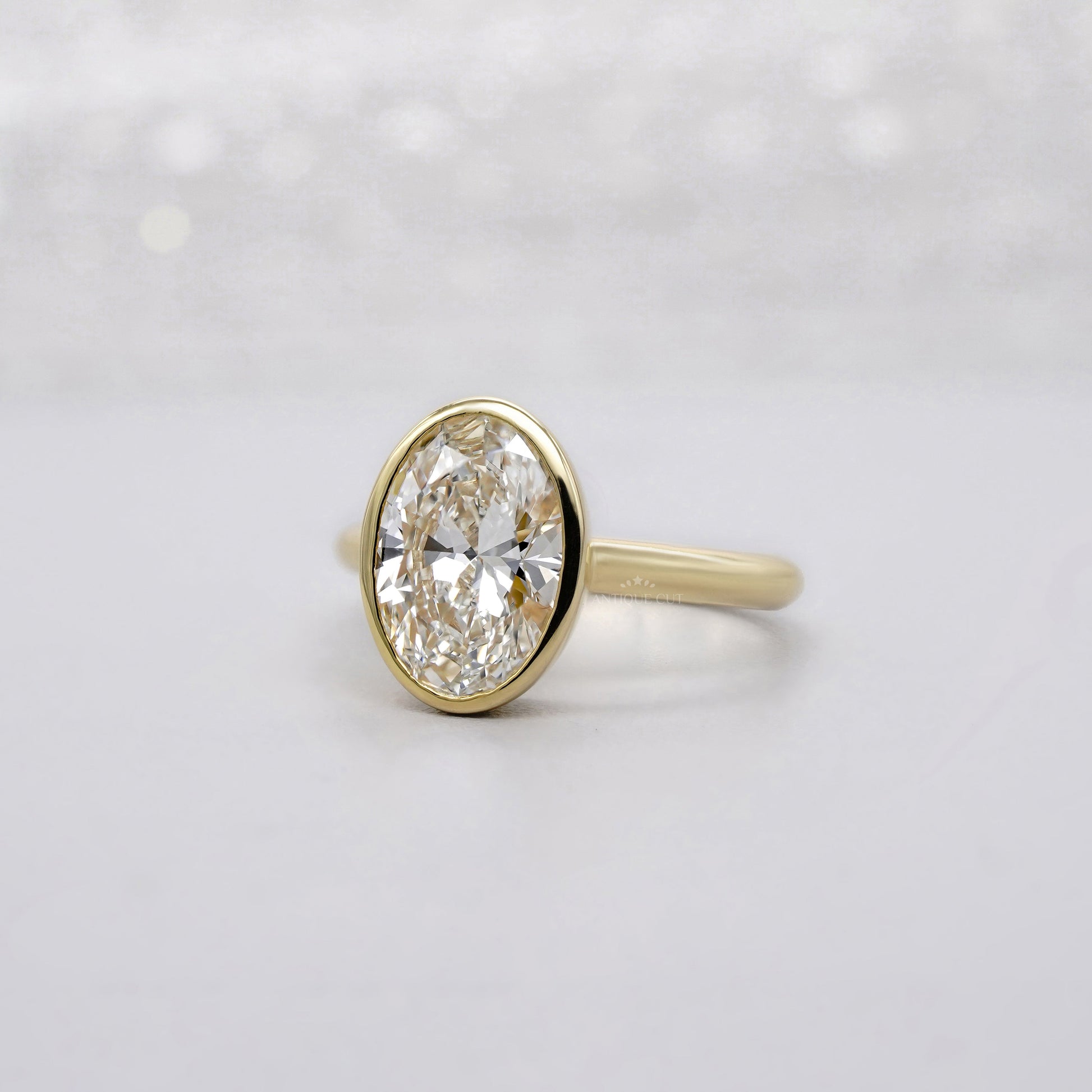 Oval 2.00ct Lab Grown Diamond Bezel Set Engagement Ring in Yellow Gold | IGI Certified