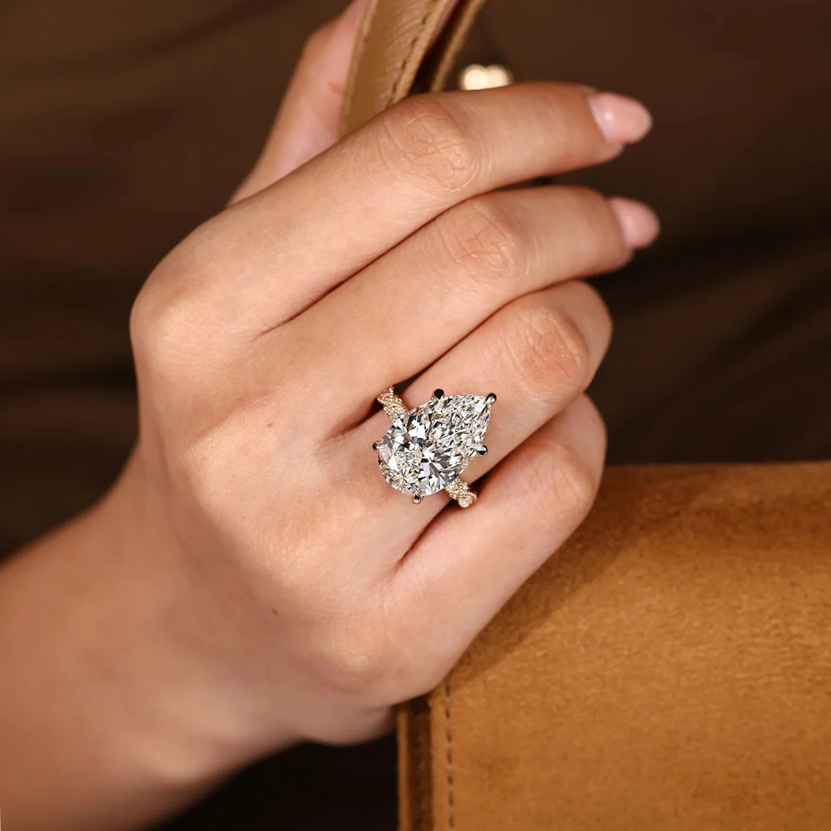 Common :: 5.20TCW Pear diamond ring with Marquise and Round accents
