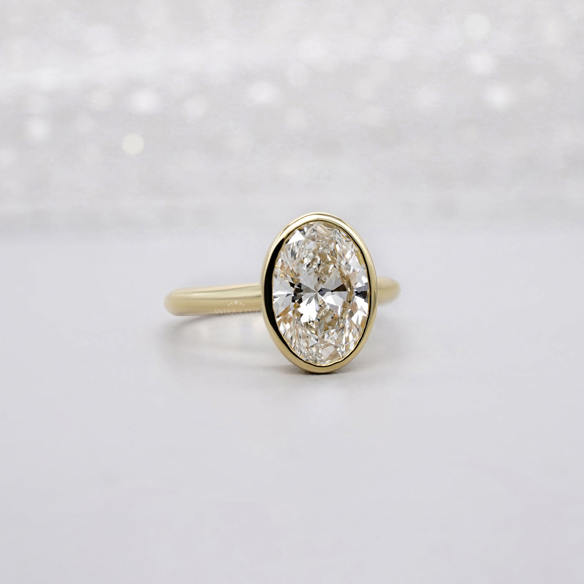 Oval 2.00ct Lab Grown Diamond Bezel Set Engagement Ring in Yellow Gold | IGI Certified