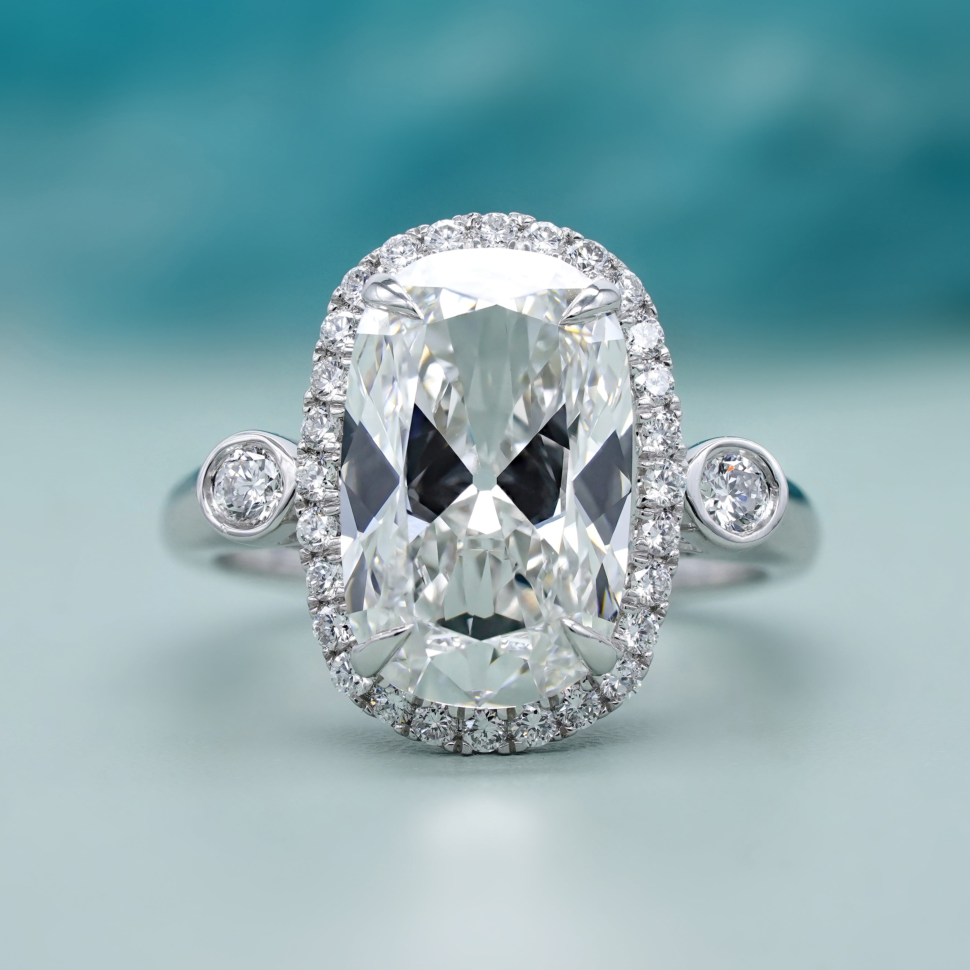 Elongated Cushion 5.40tcw Lab Grown Diamond Halo Engagement Ring | D-E-F Color | VVS–VS Clarity | IGI Certified | Unique Three Stone Ring