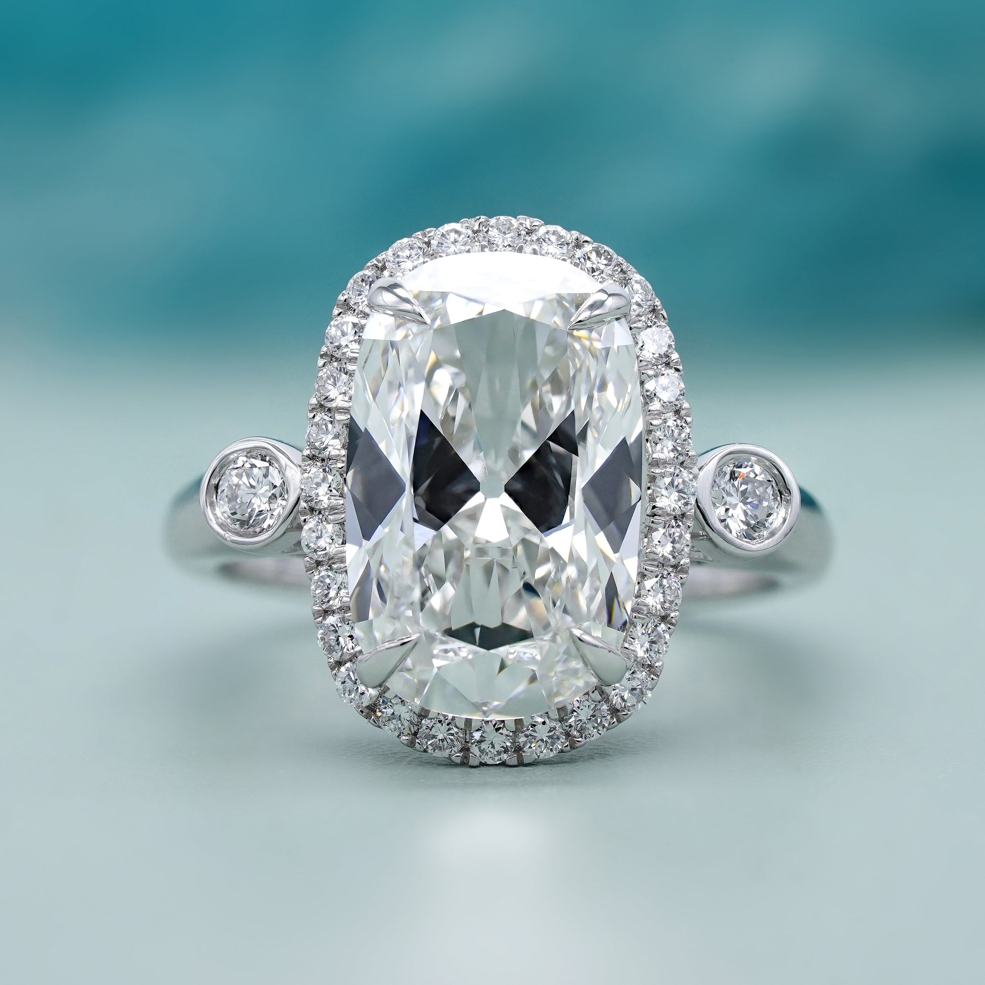 Elongated Cushion 5.40tcw Lab Grown Diamond Halo Engagement Ring | D-E-F Color | VVS–VS Clarity | IGI Certified | Unique Three Stone Ring