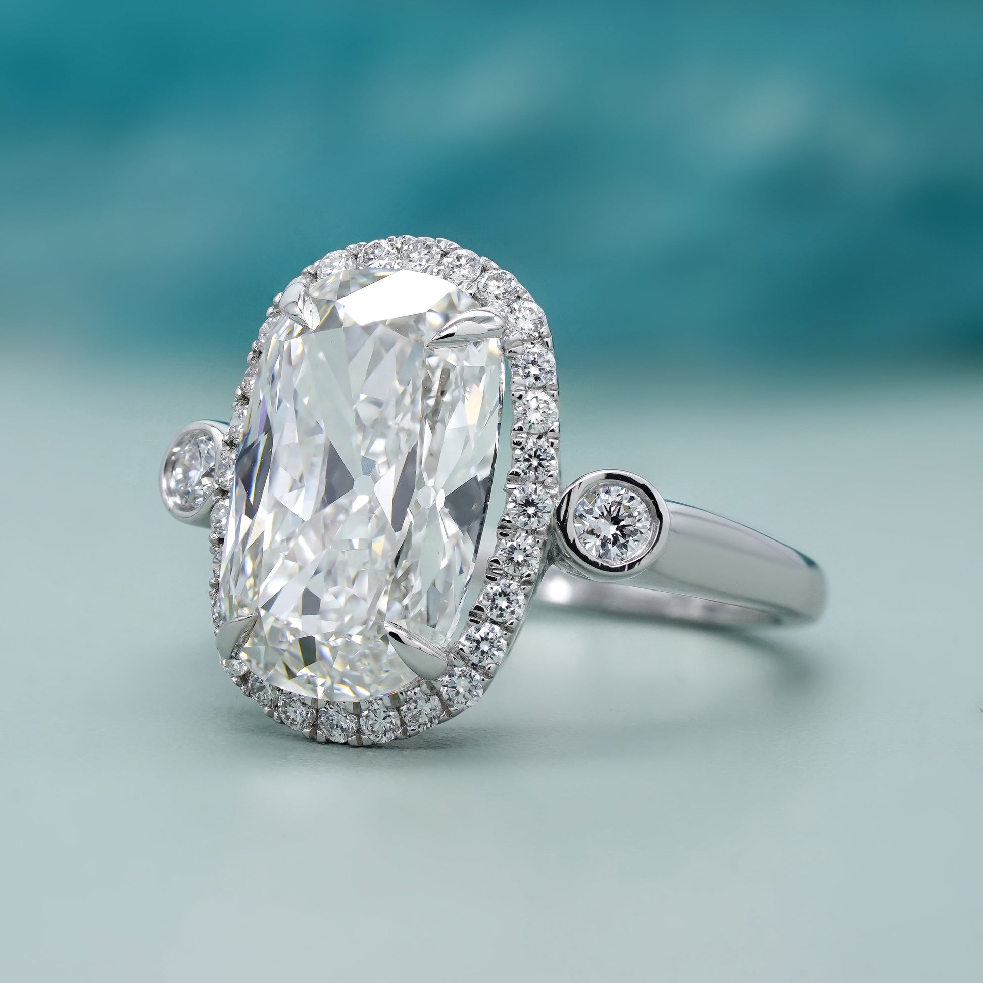 Elongated Cushion 5.40tcw Lab Grown Diamond Halo Engagement Ring | D-E-F Color | VVS–VS Clarity | IGI Certified | Unique Three Stone Ring