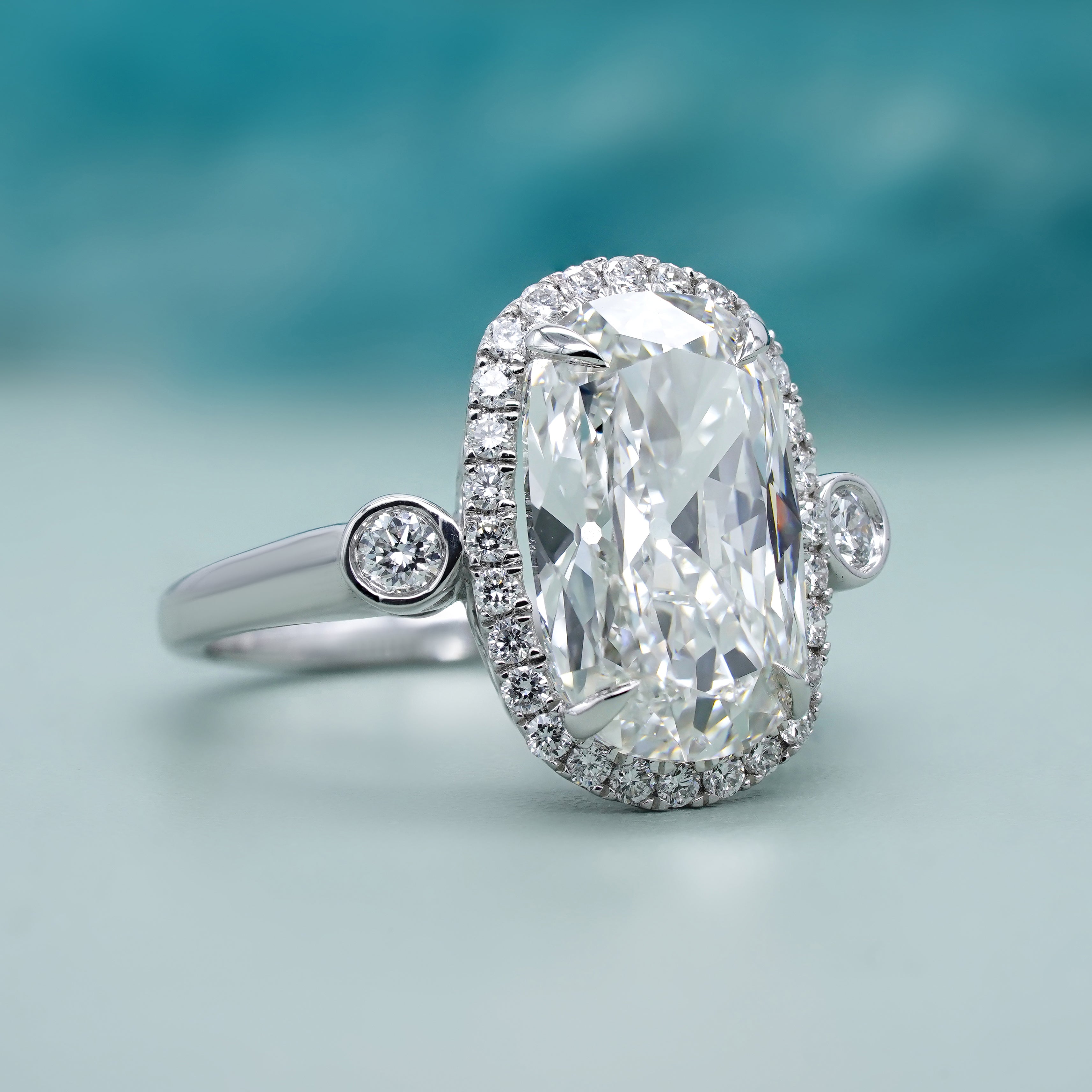 Elongated Cushion 5.40tcw Lab Grown Diamond Halo Engagement Ring | D-E-F Color | VVS–VS Clarity | IGI Certified | Unique Three Stone Ring