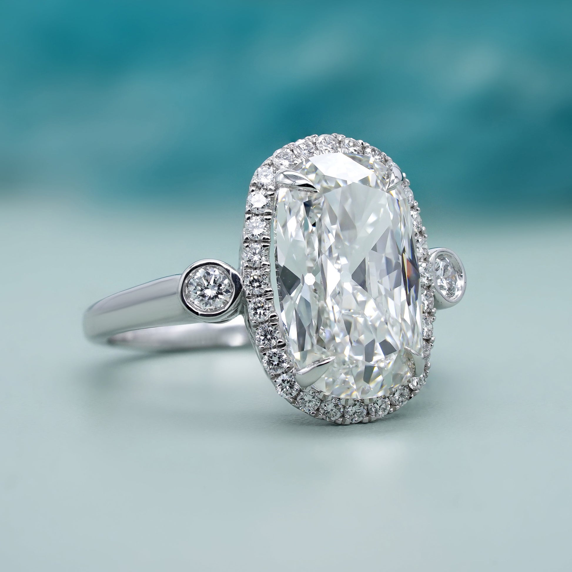 Elongated Cushion 5.40tcw Lab Grown Diamond Halo Engagement Ring | D-E-F Color | VVS–VS Clarity | IGI Certified | Unique Three Stone Ring