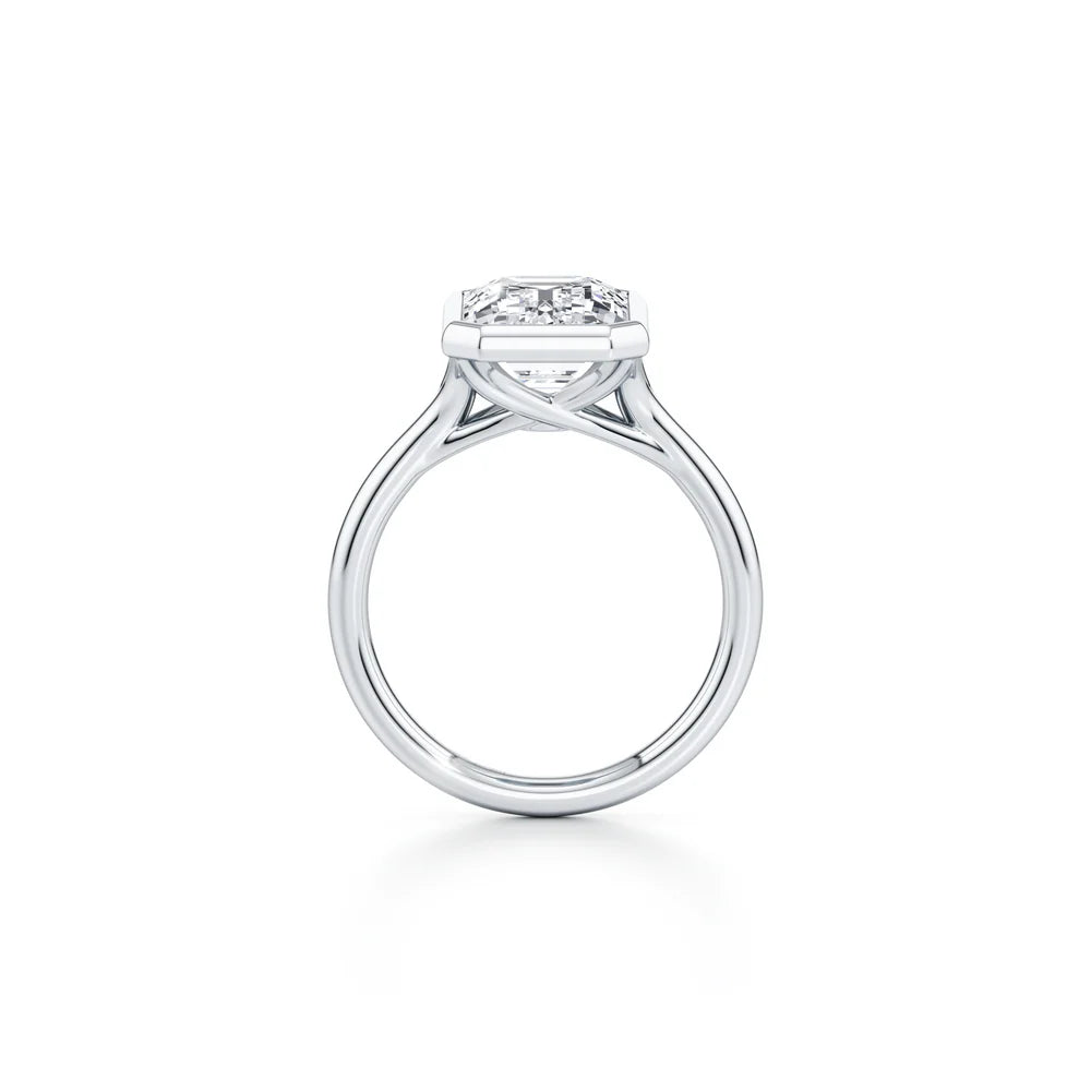 Common :: Elegant emerald cut bezel set engagement ring with lab grown diamond side angle view
