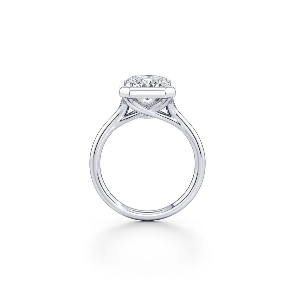 Common :: Elegant radiant cut bezel set engagement ring with lab grown diamond side angle view
