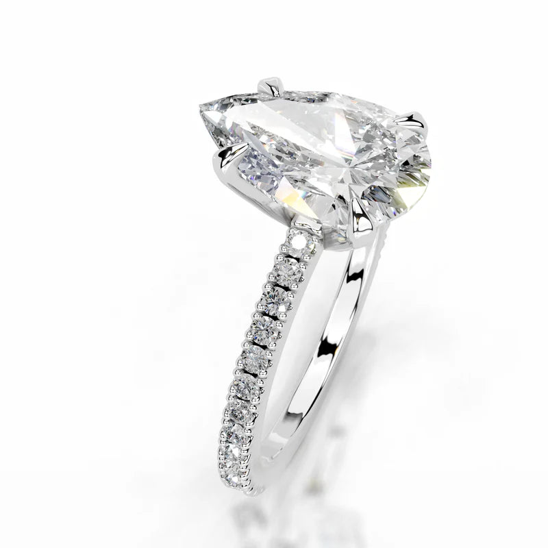 White :: Pear shaped lab grown diamond engagement ring with round diamond accents