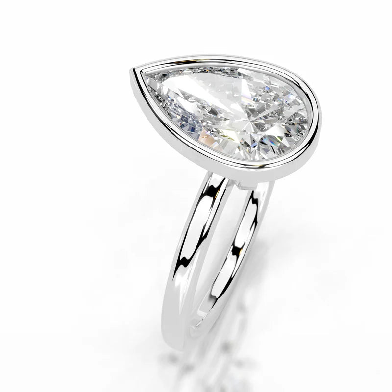 White :: Pear bezel set lab grown diamond engagement ring sleek modern style