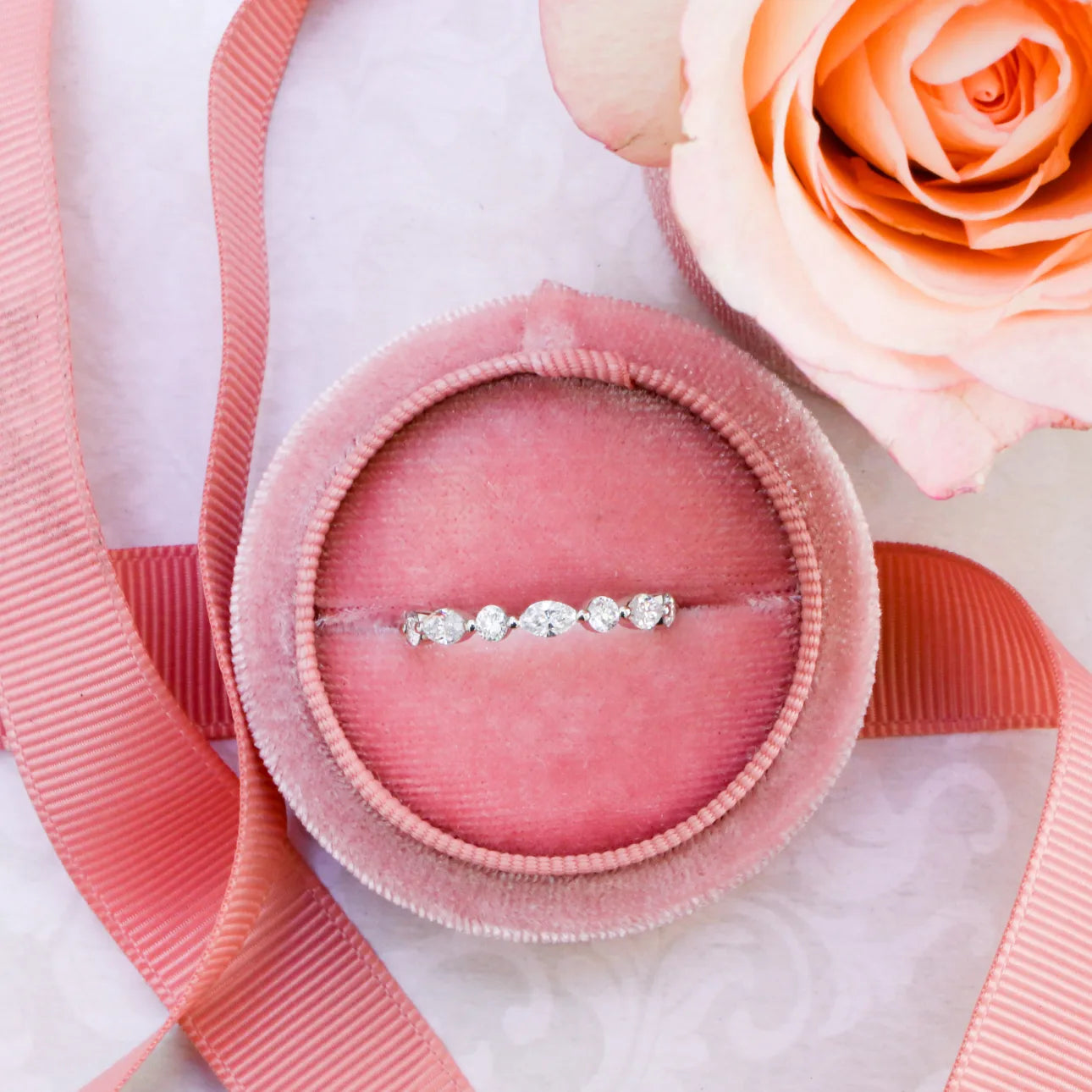 MARQUISE AND ROUND DIAMOND EAST-WEST ETERNITY BAND