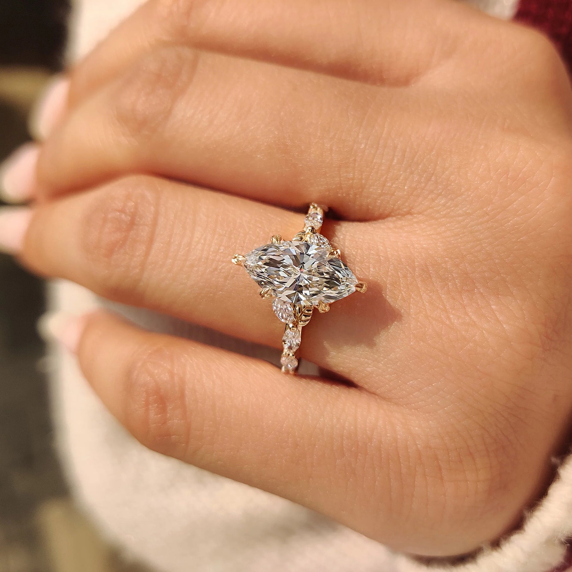 Common :: Handcrafted marquise diamond engagement ring featuring vine-inspired accents and brilliant lab grown diamonds.