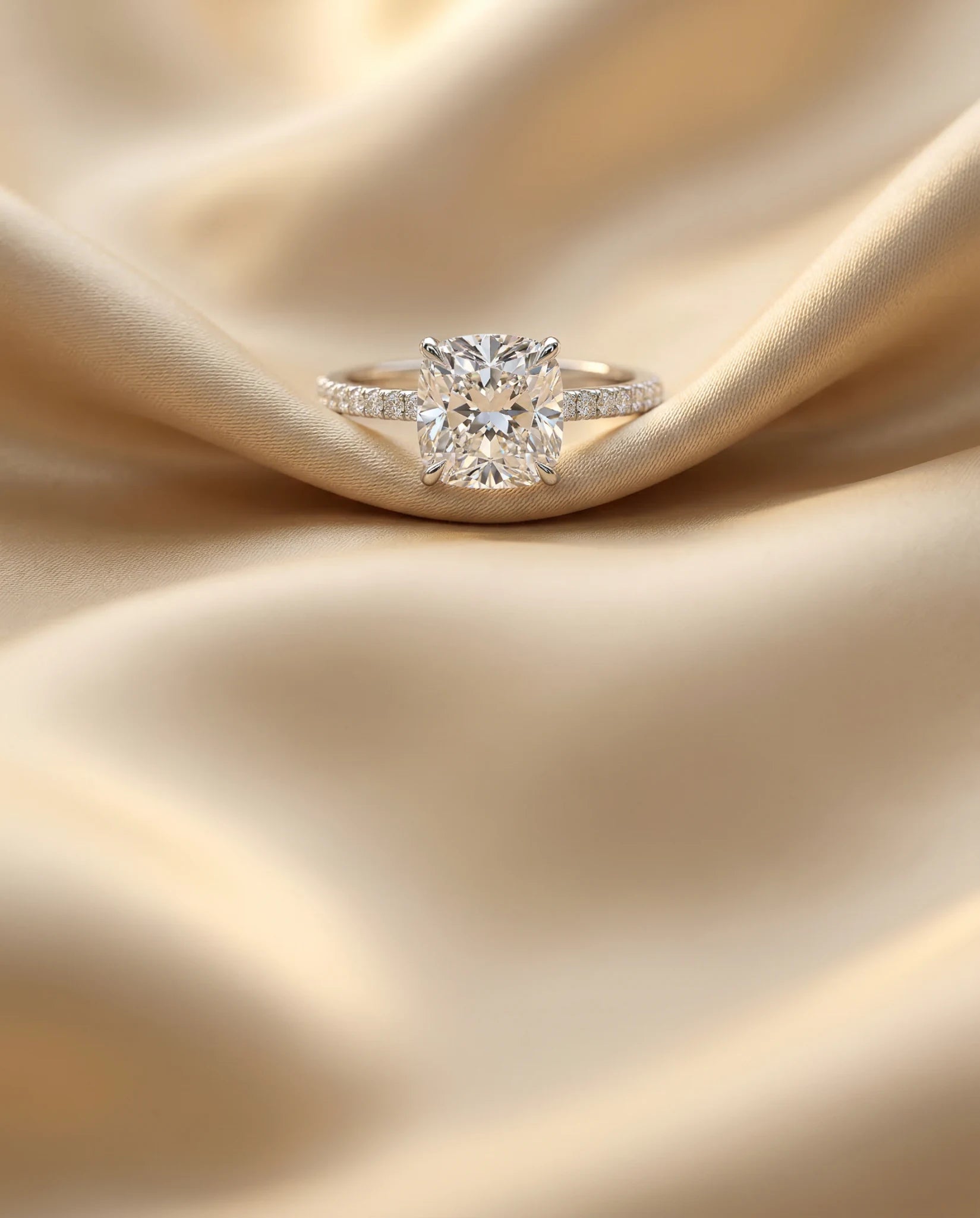 Cushion cut lab grown diamond engagement ring on champagne satin – Unii Jewels