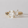 Common :: 1.57 CTW Oval and Pear Toi Et Moi lab grown diamond engagement ring in 18K yellow gold.