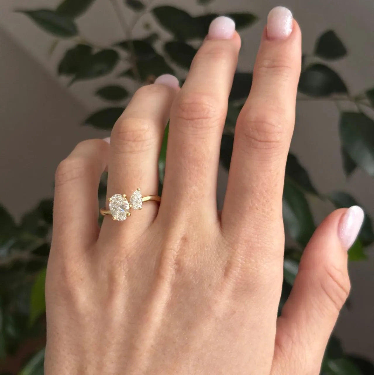 Common :: Luxury Oval and Pear engagement ring crafted in 18K yellow gold.