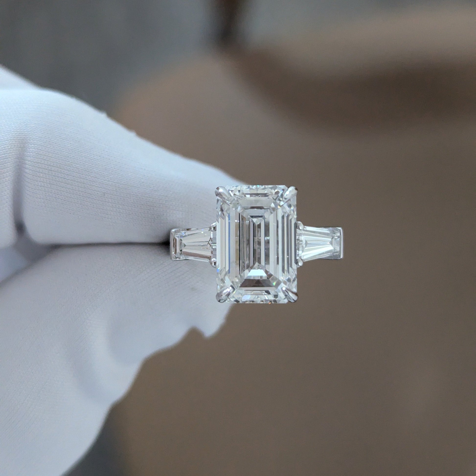 Emerald 5.80tcw Lab Diamond Three Stone Ring | IGI Certified | Tapered Baguette Side Stones