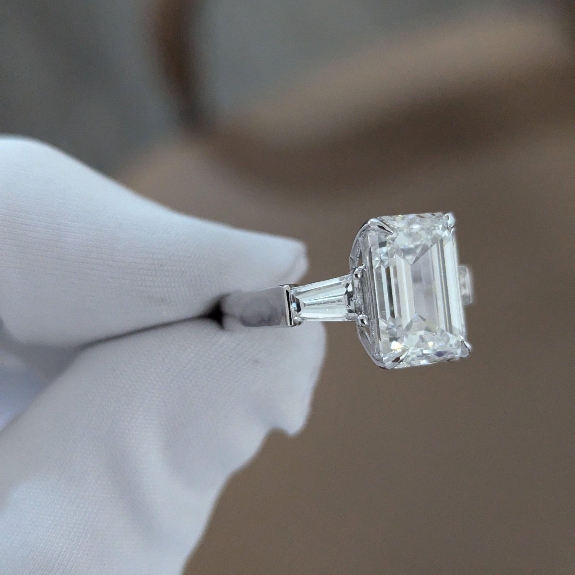 Emerald 5.80tcw Lab Diamond Three Stone Ring | IGI Certified | Tapered Baguette Side Stones