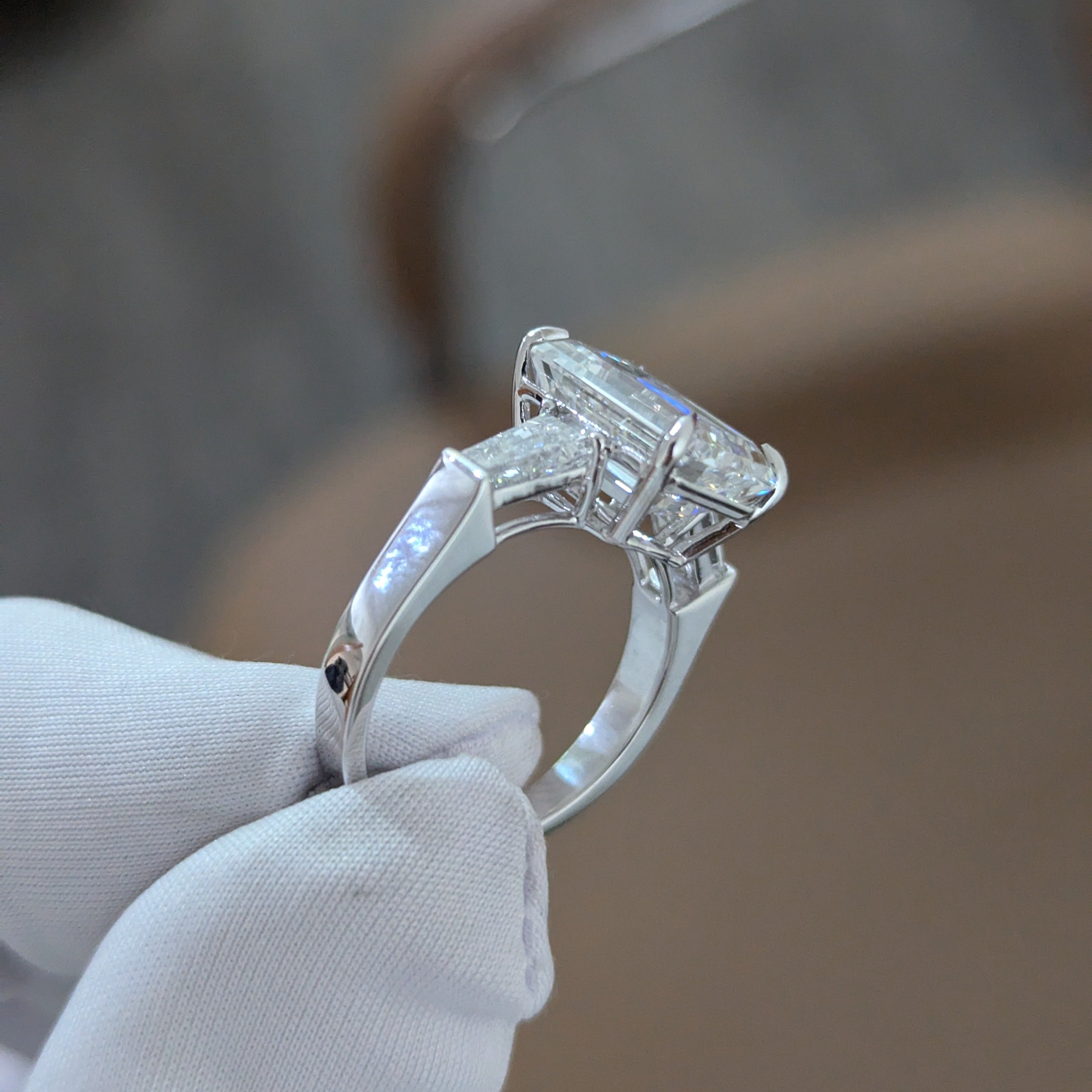 Emerald 5.80tcw Lab Diamond Three Stone Ring | IGI Certified | Tapered Baguette Side Stones