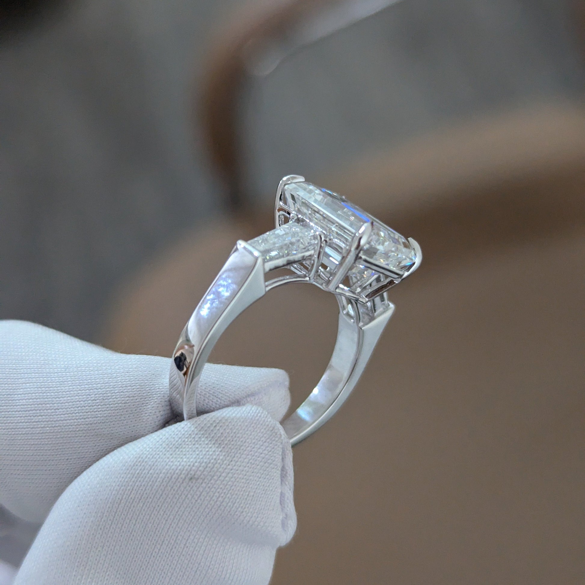 Emerald 5.80tcw Lab Diamond Three Stone Ring | IGI Certified | Tapered Baguette Side Stones