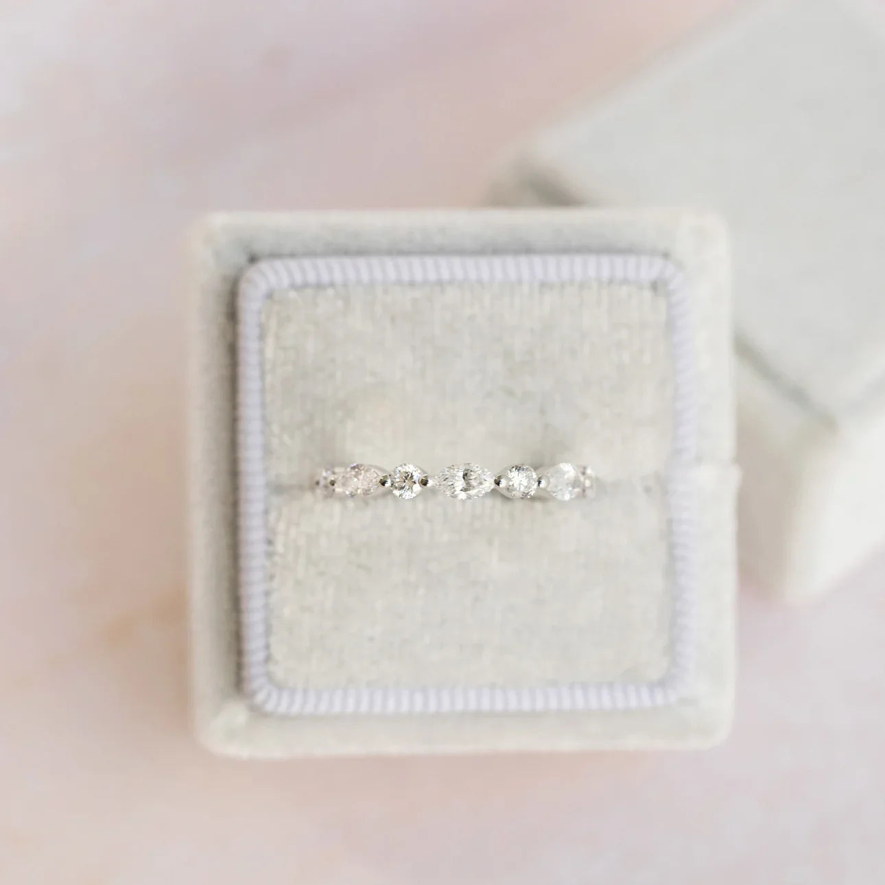 MARQUISE AND ROUND DIAMOND EAST-WEST ETERNITY BAND