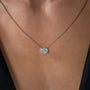 rose :: elegant rose gold solitaire pendant with sparkling oval diamond center