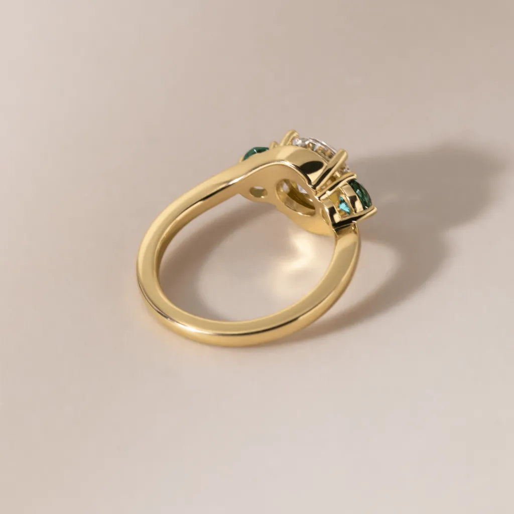 Common :: close up round three stone lab grown diamond ring brilliant sparkle engagement ring
