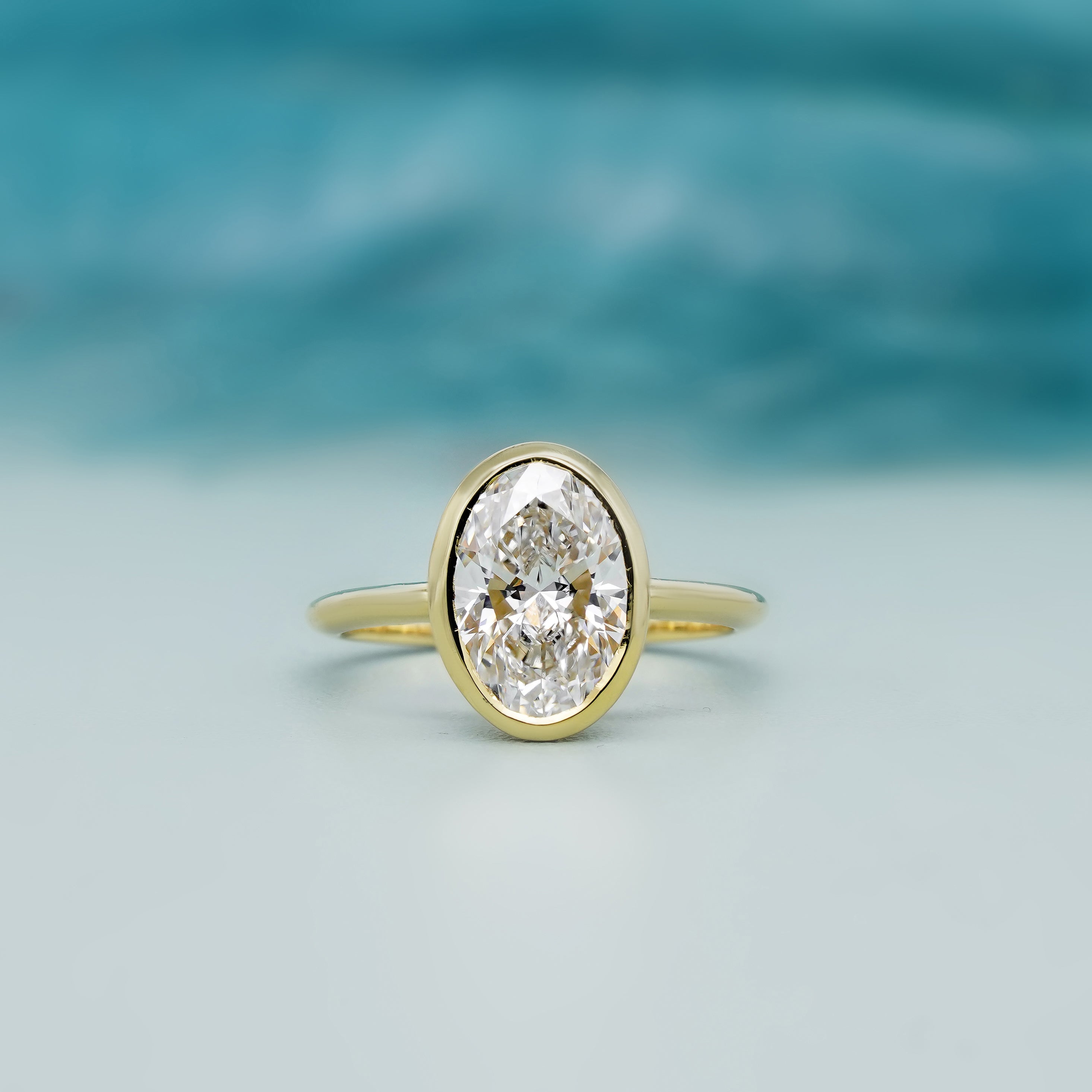Oval Cut 2.00Carat Lab Diamond Engagement Ring | Bezel Setting in Yellow Gold | D-E-F Color, VVS–VS Clarity
