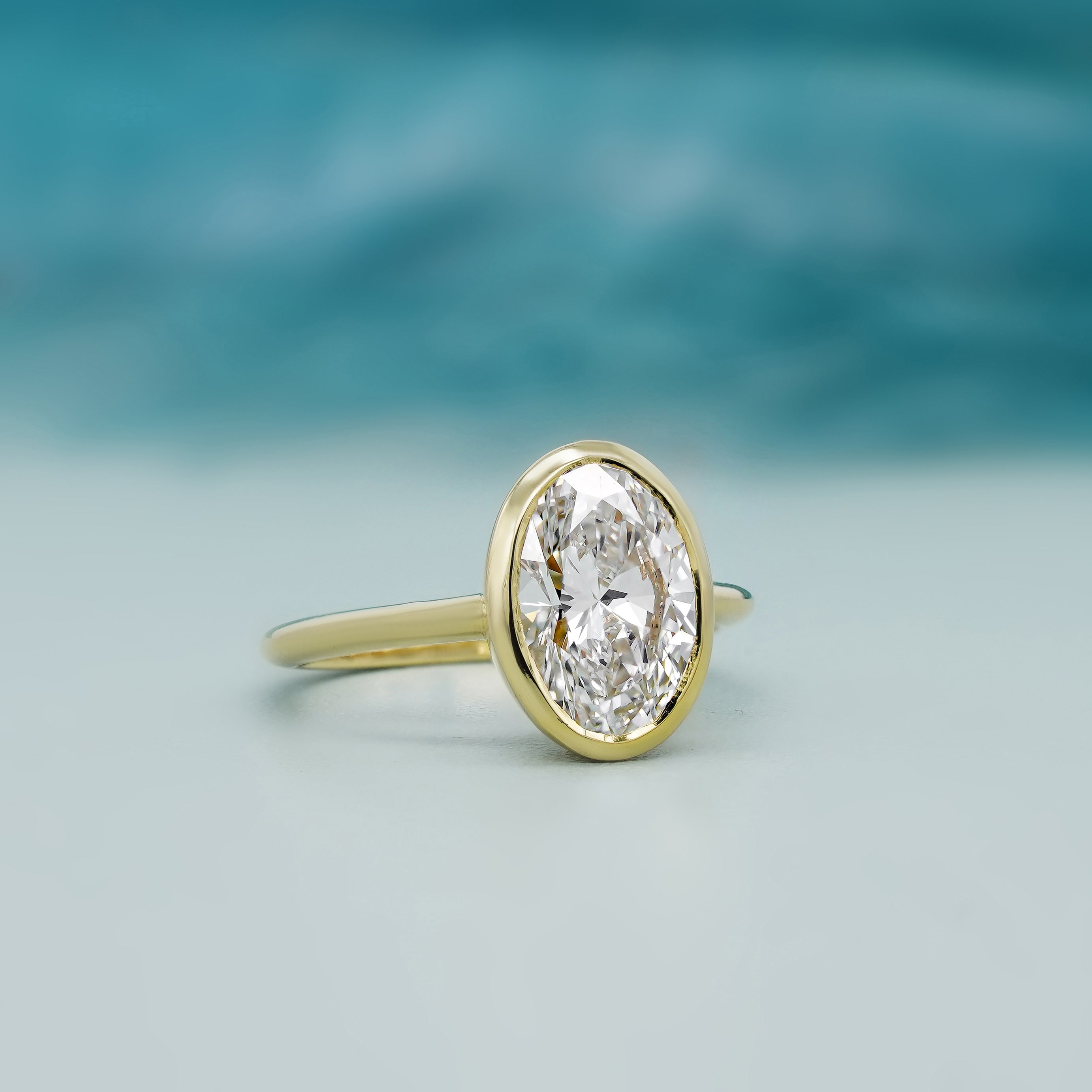 Oval Cut 2.00Carat Lab Diamond Engagement Ring | Bezel Setting in Yellow Gold | D-E-F Color, VVS–VS Clarity