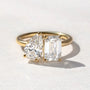 Common :: 3.50 CTW Toi Et Moi engagement ring featuring emerald and pear cut IGI certified lab diamonds in 18K yellow gold.