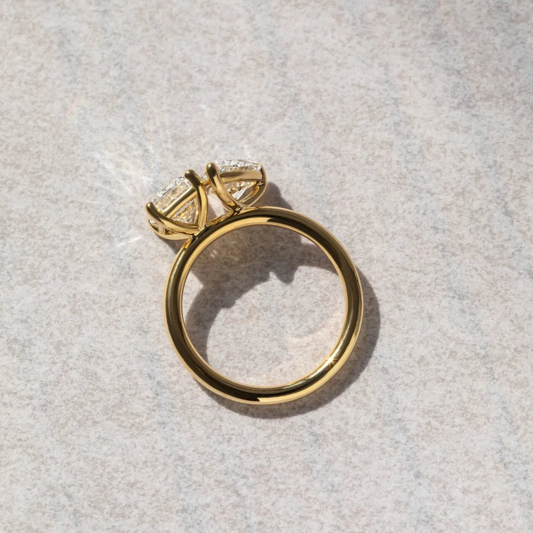 Common :: Elegant pear and emerald diamond engagement ring handcrafted for modern brides.