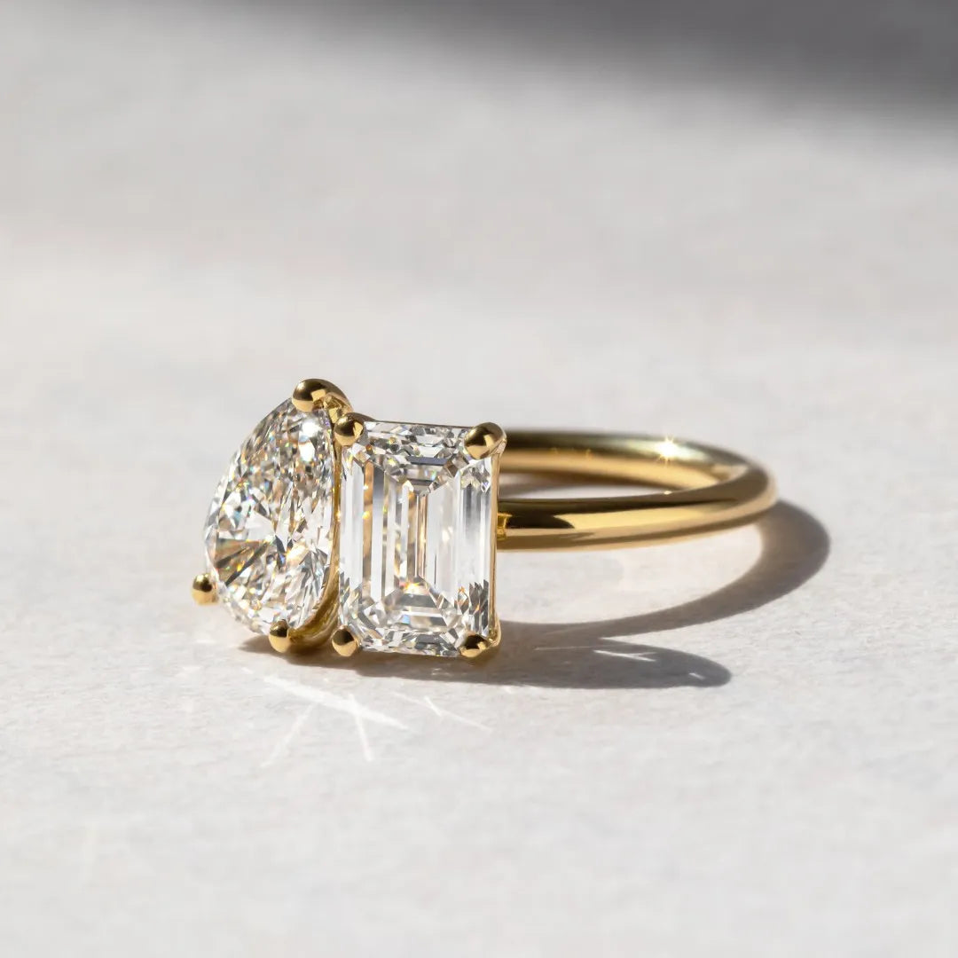 Common :: IGI certified two stone engagement ring with emerald and pear cut lab diamonds.