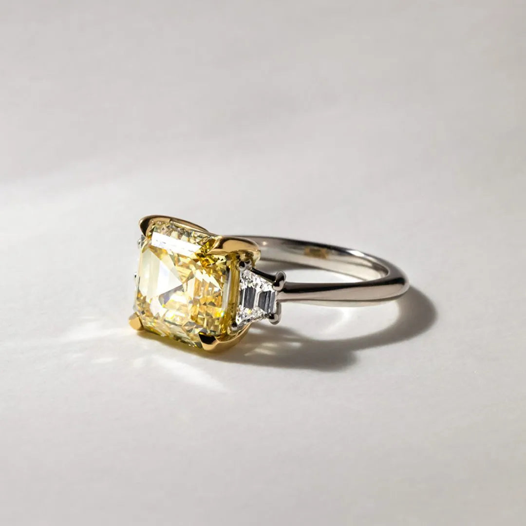 Common :: fancy yellow emerald cut diamond trilogy ring IGI certified lab grown ring