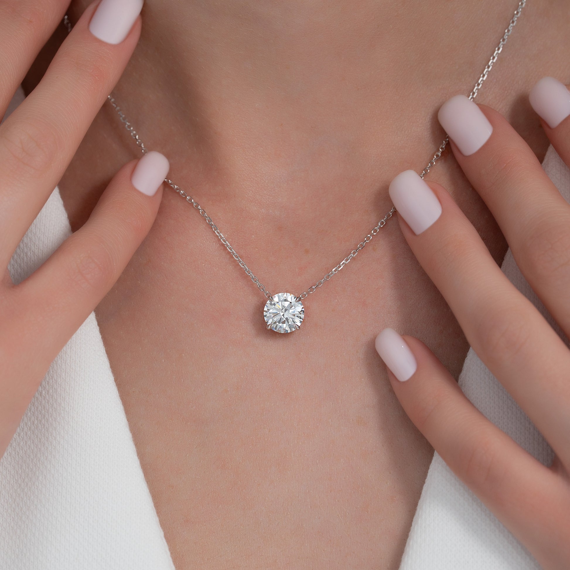 white :: contemporary white gold solitaire necklace with round brilliant center stone