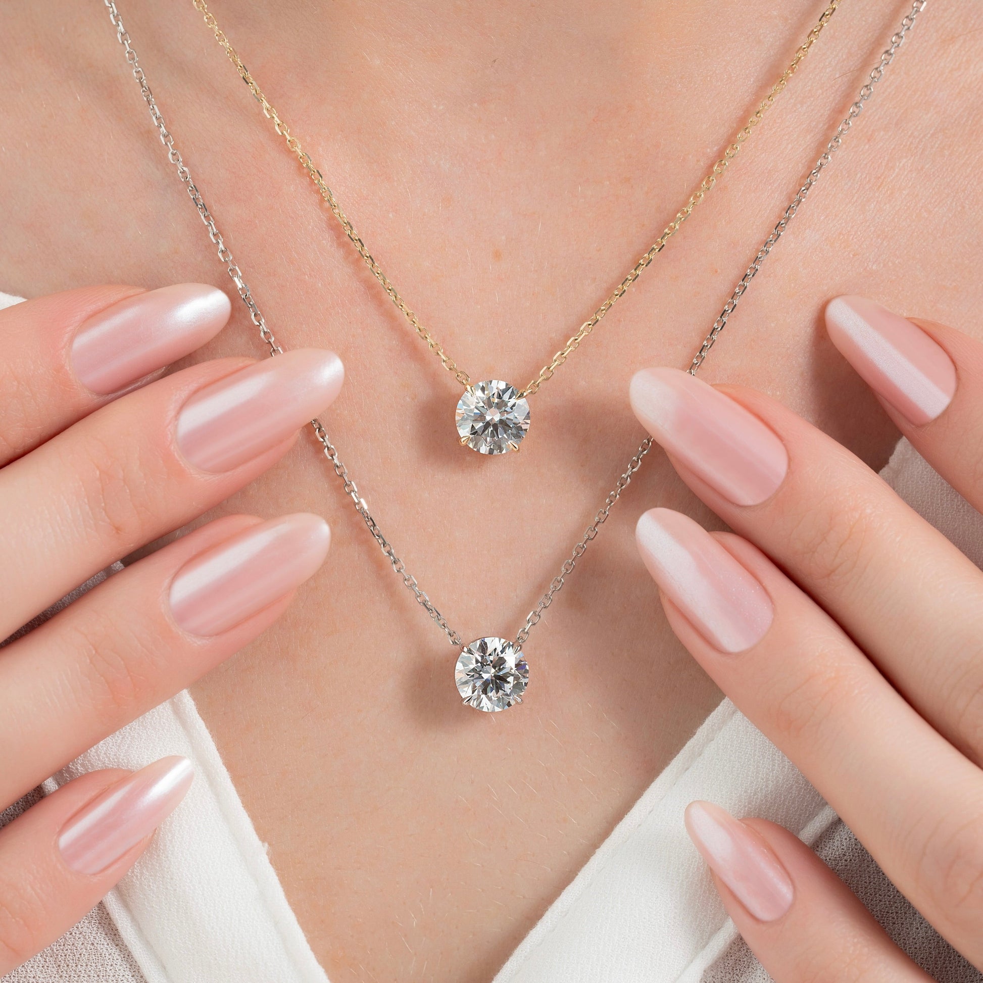 white :: classic white gold pendant necklace showcasing brilliant round diamond fire
