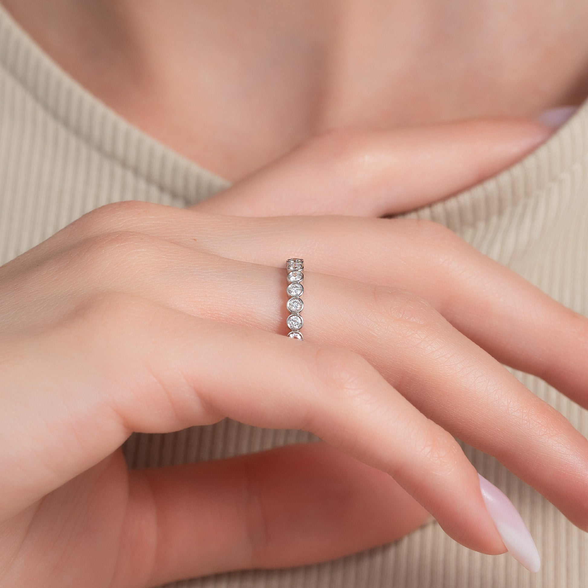 White :: close up 0.5ct round bezel lab grown diamond eternity ring white gold sleek design