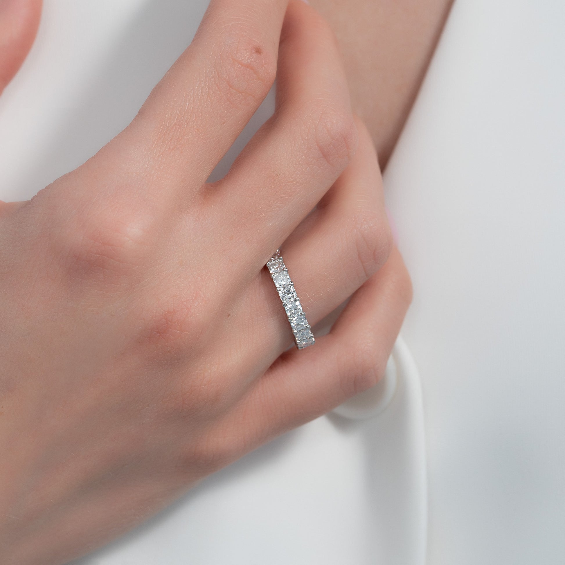 White :: close up 3ct cushion lab grown diamond eternity ring white gold soft edge sparkle