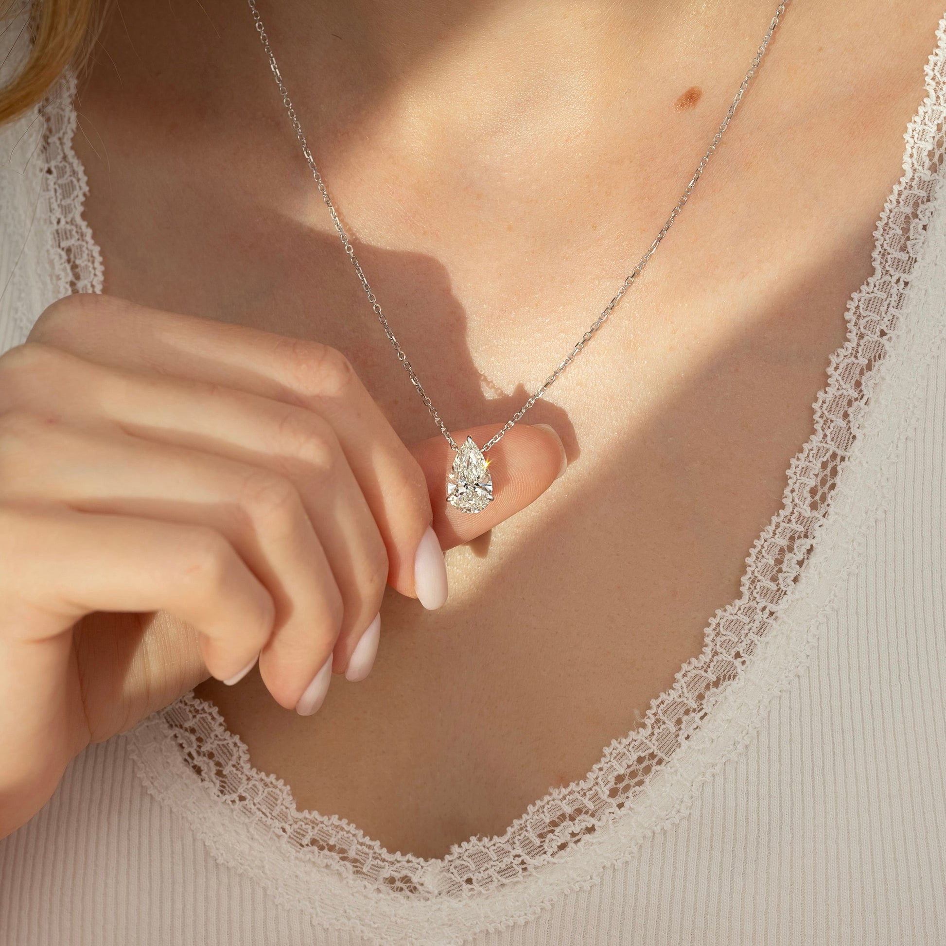 white :: elegant pear cut pendant necklace crafted in white gold