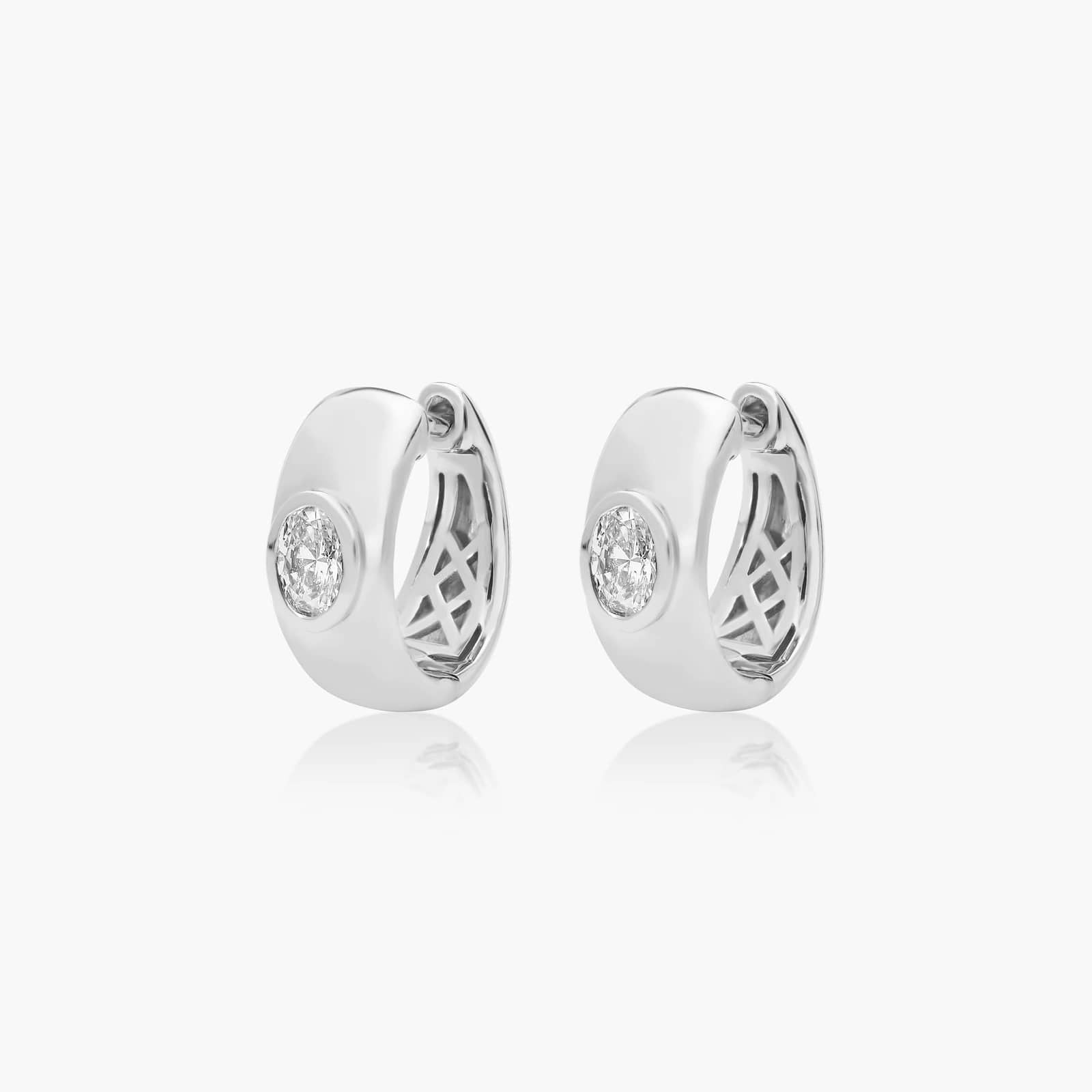 White :: modern oval bezel lab grown diamond hoop earrings huggie style white gold sleek minimal jewelry