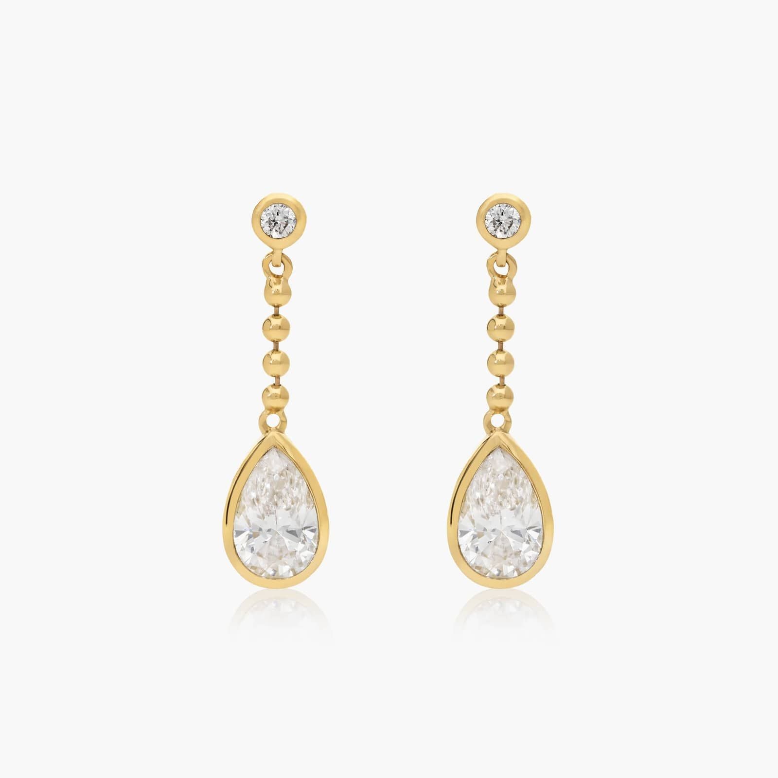 Common :: pear shape lab grown diamond bezel chain drop earrings elegant teardrop design white gold modern fine jewelry