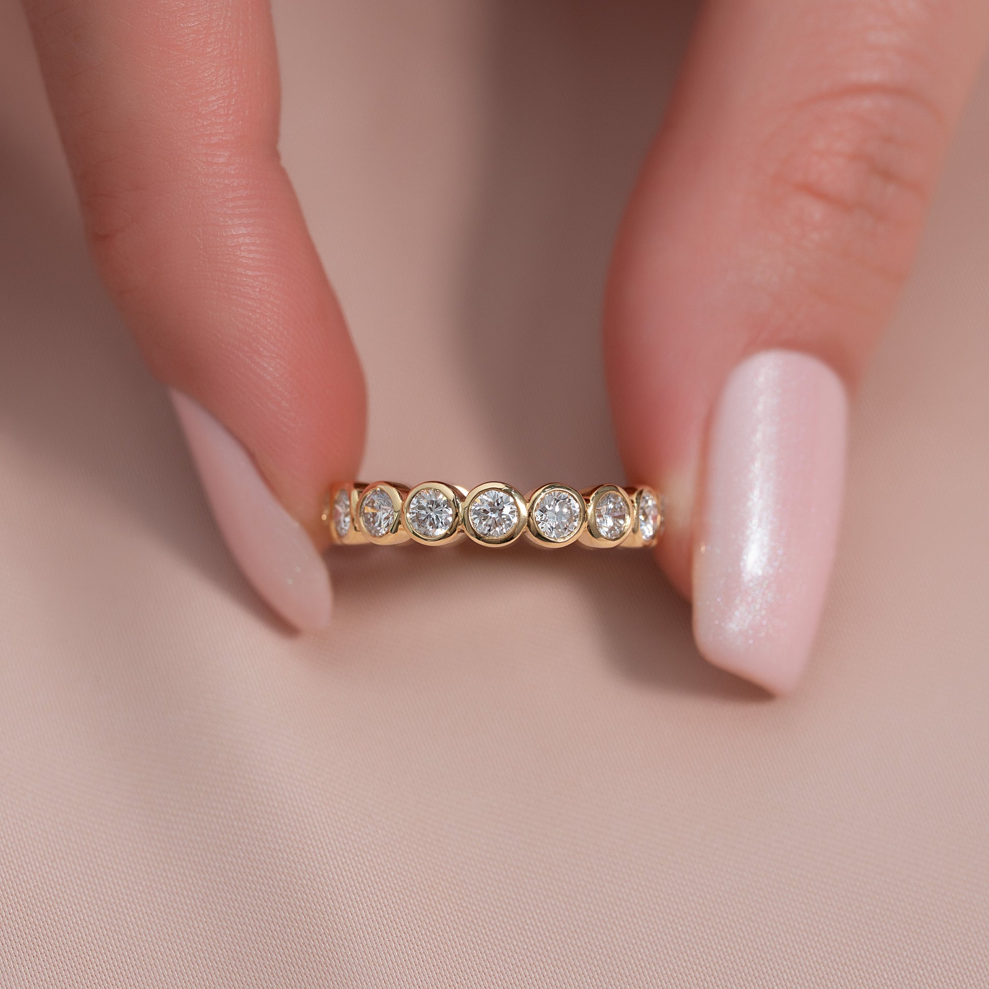 Yellow :: classic 1.5ct round bezel lab grown diamond eternity ring yellow gold statement band