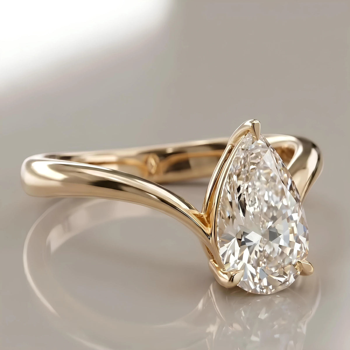 Common :: Luxury pear shaped lab grown diamond ring with flowing band design