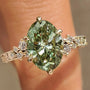 Common :: Green Oval diamond ring with 0.10TCW Round diamond accents