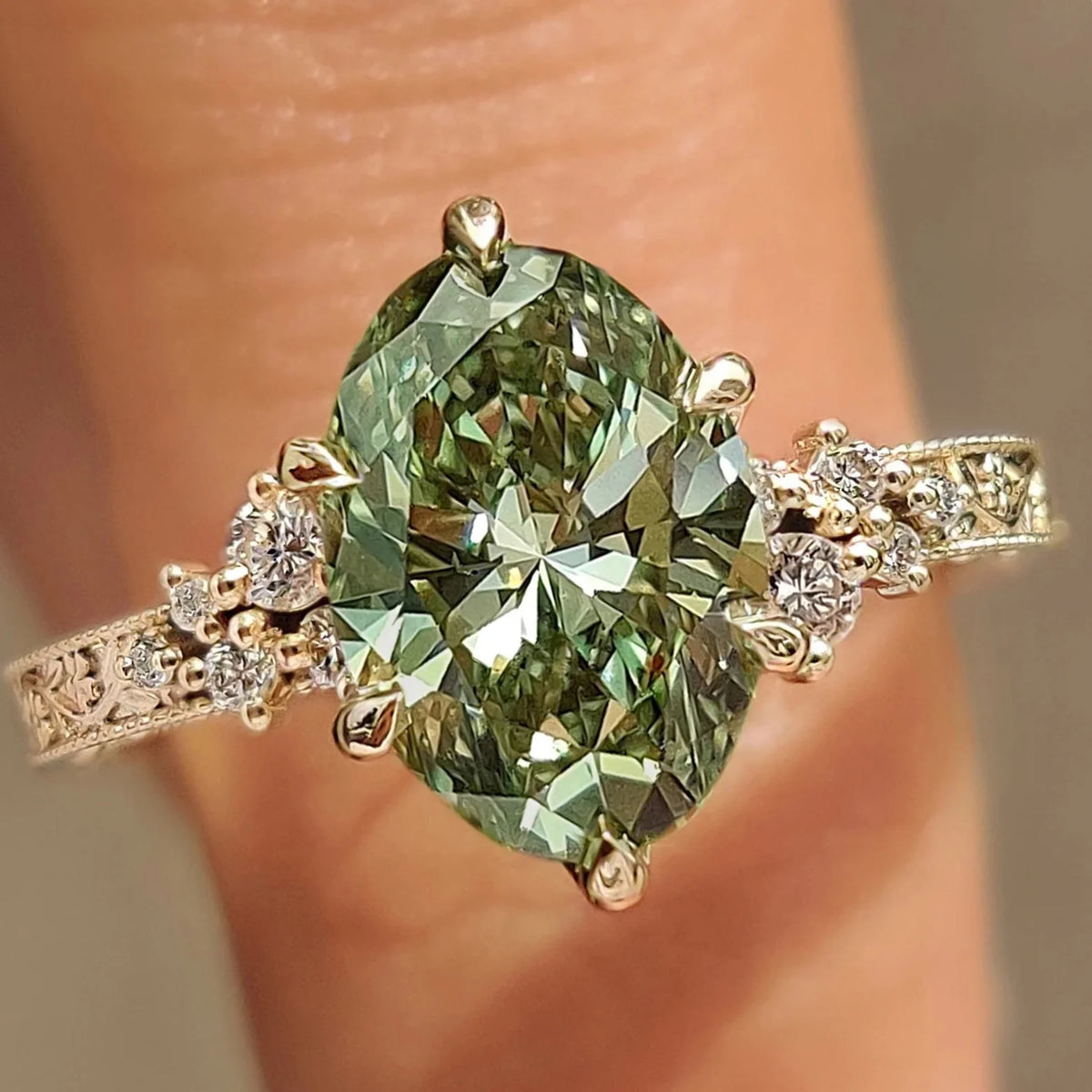 Common :: Green Oval diamond ring with 0.10TCW Round diamond accents