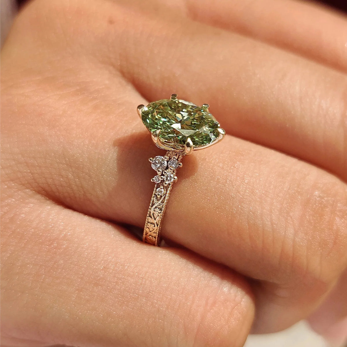 Common :: 1CT Green Oval center with D E F Round diamond accents